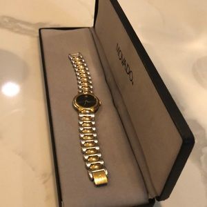 Vintage Movado two-tone lady’s watch black face.